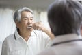 Japanese old man playing toothpaste, Royalty Free Stock Photo