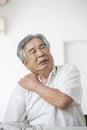 Japanese old man suffering from shoulder pain