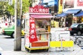 Japanese older people sale product at local small shop on pathway at Shinjuku city