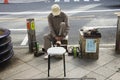 Japanese older people serviced repair shoes on pathway beside tr