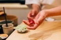 Japanese Omakase chef making Chutoro Sushi Medium Fatty Bluefin Tuna neatly by hands. Japanese traditional, authentic and luxury Royalty Free Stock Photo