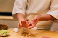 Japanese Omakase making Chutoro Sushi Medium Fatty Bluefin Tuna neatly by hands. Japanese traditional and luxury meal