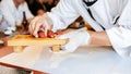 Japanese Omakase meal: Aging Raw Akami Tuna Sushi adds with sliced truffle served by hand on a stone plate. Royalty Free Stock Photo