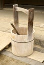 A Japanese pail or a wooden bucket and a ladle or a dipper