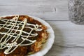 Japanese pancake called okonomiyaki on the plate