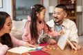 Japanese Parents Teaching Little Daughter Playing Educational Game At Home Royalty Free Stock Photo