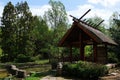 Japanese pavilion with pond and columns as pathway across the pond, far east trees and decorative shrubs around, spring season Royalty Free Stock Photo