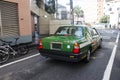 Japanese people driving taxi recieve people and send to Shibuya
