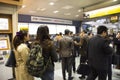 Japanese people and foreign traveler passenger wait and stand in queue for buy ticket MRT trains from auto vending machine Royalty Free Stock Photo