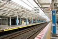 Japanese people passengers wait and walking up and down journey with MRT Tozai Line trains at Kasai Station in Tokyo, Japan Royalty Free Stock Photo