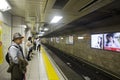 Japanese people and foreigner traveler waiting subway train go t