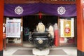 Japanese people pray buddha god and angel statue inside of Marishiten Tokudaiji Temple in Ameyoko market at Ueno in Tokyo, Japan Royalty Free Stock Photo