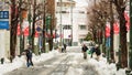 Japanese people removing snow with a shovel