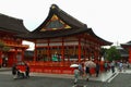 Japanese people and tourists enter Fushimi Inari Shrine