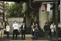Japanese people and traveler foreigner waiting traffic sign for
