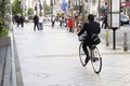 Japanese people walking crosswalk traffic road and biking bicycle on pathway