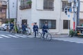 Japanese Police Bicycle Squad Officer Patrolling cycling at road