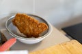 Japanese pork Tonkatsu homemade cutlet on sieve