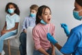 Japanese preteen girl getting tested for covid-19 in clinic indoor Royalty Free Stock Photo