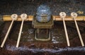 Japanese purify water fountain, called chozubachi, at Fushimi Inari shrine, Kyoto, Japan Royalty Free Stock Photo