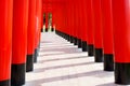 Japanese red wooden poles with blue sky.Walkway with red wooden poles Japanese style
