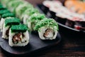 Assortment of sushi rolls served on black plate Royalty Free Stock Photo