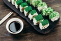 Sushi rolls plate with sauce and chopsticks Royalty Free Stock Photo