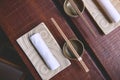 Japanese restaurant in traditional style, Empty plate on mat near chopstick bowl, Selective Focus Royalty Free Stock Photo