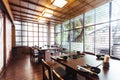 Japanese restaurant with wooden decorated. Large glass window for natural light. Bright and cozy with tables and seats