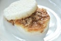 Japanese rice burger stuffed stir-fried slice pork with soy sauce on plate