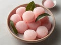 Japanese rice dessert mochi close-up. Soft pink mochi cakes