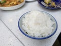 Japanese rice. Steaming hot cooked rice in white bowl Royalty Free Stock Photo