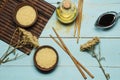 Japanese rice in a wooden bowl. Wooden chopsticks On the table of a bamboo mat. Asian cuisine. View from above. Royalty Free Stock Photo