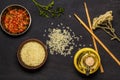 Japanese rice in a wooden bowl. Wooden chopsticks On the table of a bamboo mat. Asian cuisine. View from above. Royalty Free Stock Photo