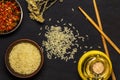 Japanese rice in a wooden bowl. Wooden chopsticks On the table of a bamboo mat. Asian cuisine. View from above. Royalty Free Stock Photo