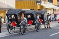 Japanese rickshaw drivers waiting in a row for customers in Kyoto, Japan