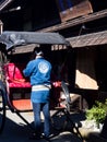 Japanese rickshaw man with his cart