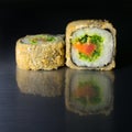 Japanese roll breaded with rice, chuk and three types of fish, salmon, eel, tuna