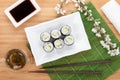Japanese roll with cucumber and fresh sakura branch