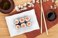 Japanese roll with salmon and fresh sakura branch