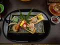 Japanese ryokan kaiseki dinner decorative sashimi set including Pacific blue fin tuna, shrimp, greater amberjack, halfbeak