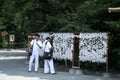 Japanese Sailors visiting Temple and making a wish in Kamakura, Japan Royalty Free Stock Photo