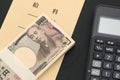 Japanese salary envelope and calculator Royalty Free Stock Photo