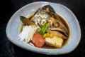 Japanese salmon head steamed with vegetables.