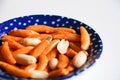 Japanese salty snack Kaki No Tane or Persimmon Seeds Sembei with Peanuts isolated on blue plate with a side view Royalty Free Stock Photo