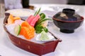 Japanese Sashimi set on boat plate with Miso soup in Japanese bowl Royalty Free Stock Photo