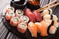 Japanese seafood, restaurant menu photo. great colorful set of fresh sushi rolls with salmon, tuna, nigiri and maki served in Royalty Free Stock Photo