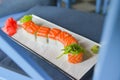 Japanese seafood sushi set on dark background served in a white round plate. Traditional Japanese cuisine concept Royalty Free Stock Photo