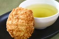 Japanese Rice Cracker with Green Tea. Royalty Free Stock Photo