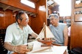 Japanese senior man, yacht hobby friend Royalty Free Stock Photo